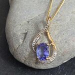 1.06ct Tanzanite & Diamond Swirl Pendant Necklace 9ct Yellow Gold from Ace Jewellery, Leeds