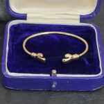 9ct Yellow Gold Boxing Glove Torque Baby Bangle from Ace Jewellery, Leeds