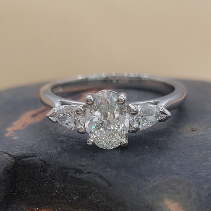 1.10ct Oval Diamond with Pear Diamond Trilogy Engagement Ring Platinum from Ace Jewellery, Leeds