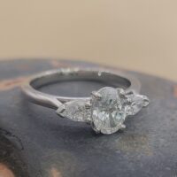 1.10ct Oval Diamond with Pear Diamond Trilogy Engagement Ring Platinum from Ace Jewellery, Leeds