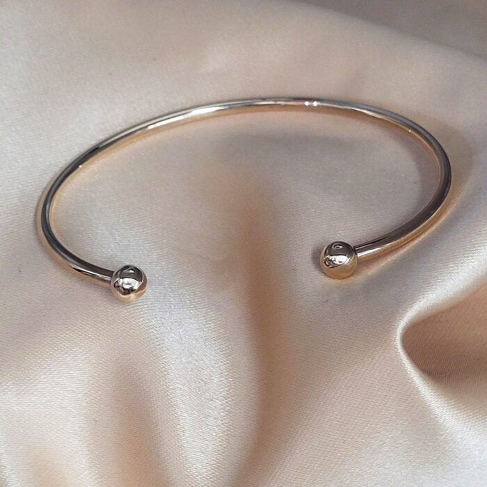 9ct Yellow Gold Solid Torc Bangle from Ace Jewellery, Leeds