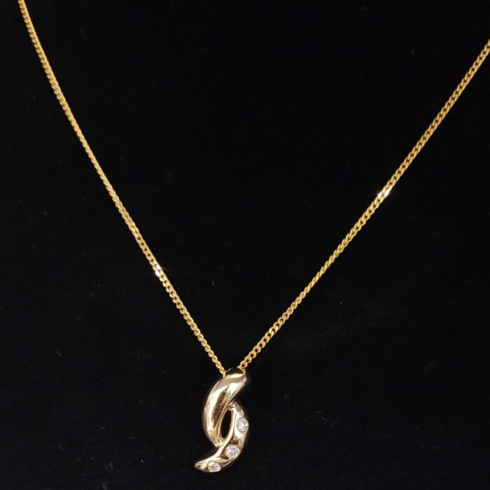 0.06ct Diamond Twist Pendant Necklace 9ct Yellow Gold from Ace Jewellery, Leeds