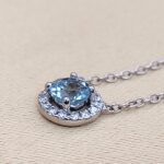 0.65ct Aquamarine & Diamond Halo Pendant Necklace 18ct White Gold from Ace Jewellery, Leeds