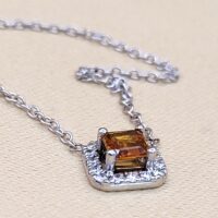 0.57ct Yellow Sapphire & Diamond Halo Pendant Necklace Platinum from Ace Jewellery, Leeds