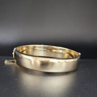 9ct Yellow Gold Half Engraved Hinged Bangle from Ace Jewellery, Leeds