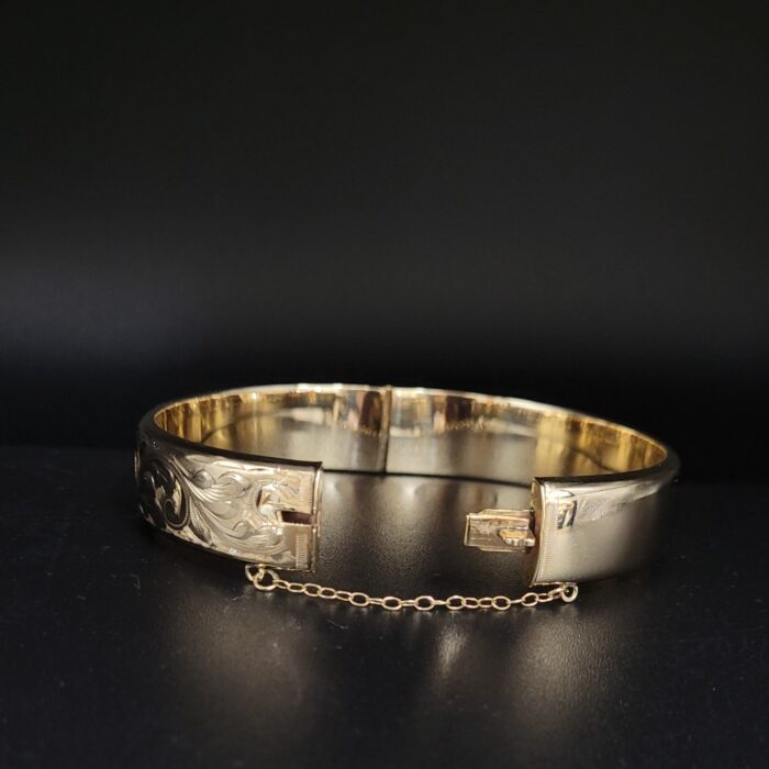 9ct Yellow Gold Half Engraved Hinged Bangle from Ace Jewellery, Leeds