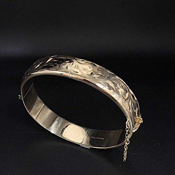 9ct Yellow Gold Half Engraved Hinged Bangle from Ace Jewellery, Leeds